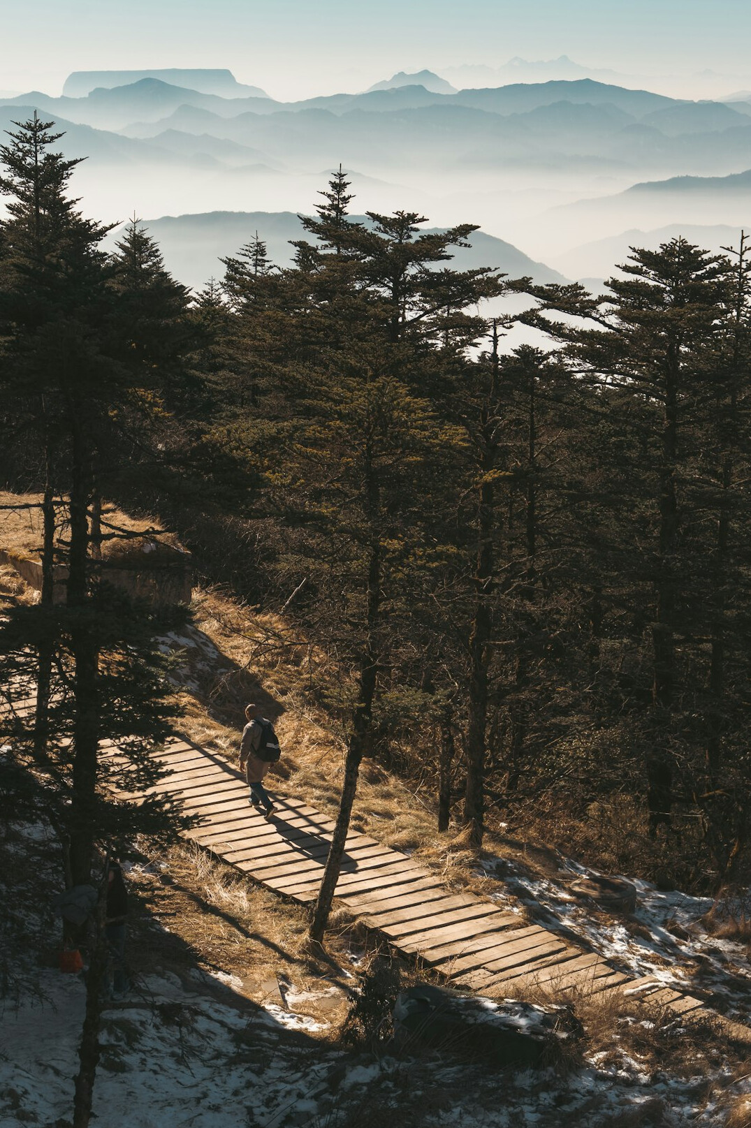 person walking on mountain path