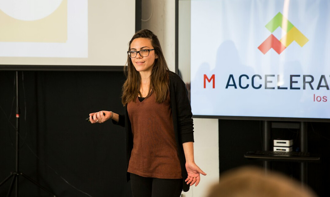 woman presenting to audience