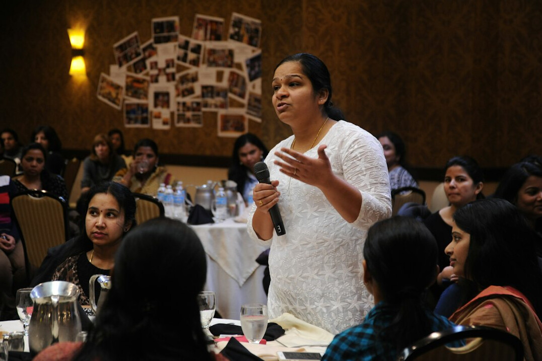 woman presenting to audience
