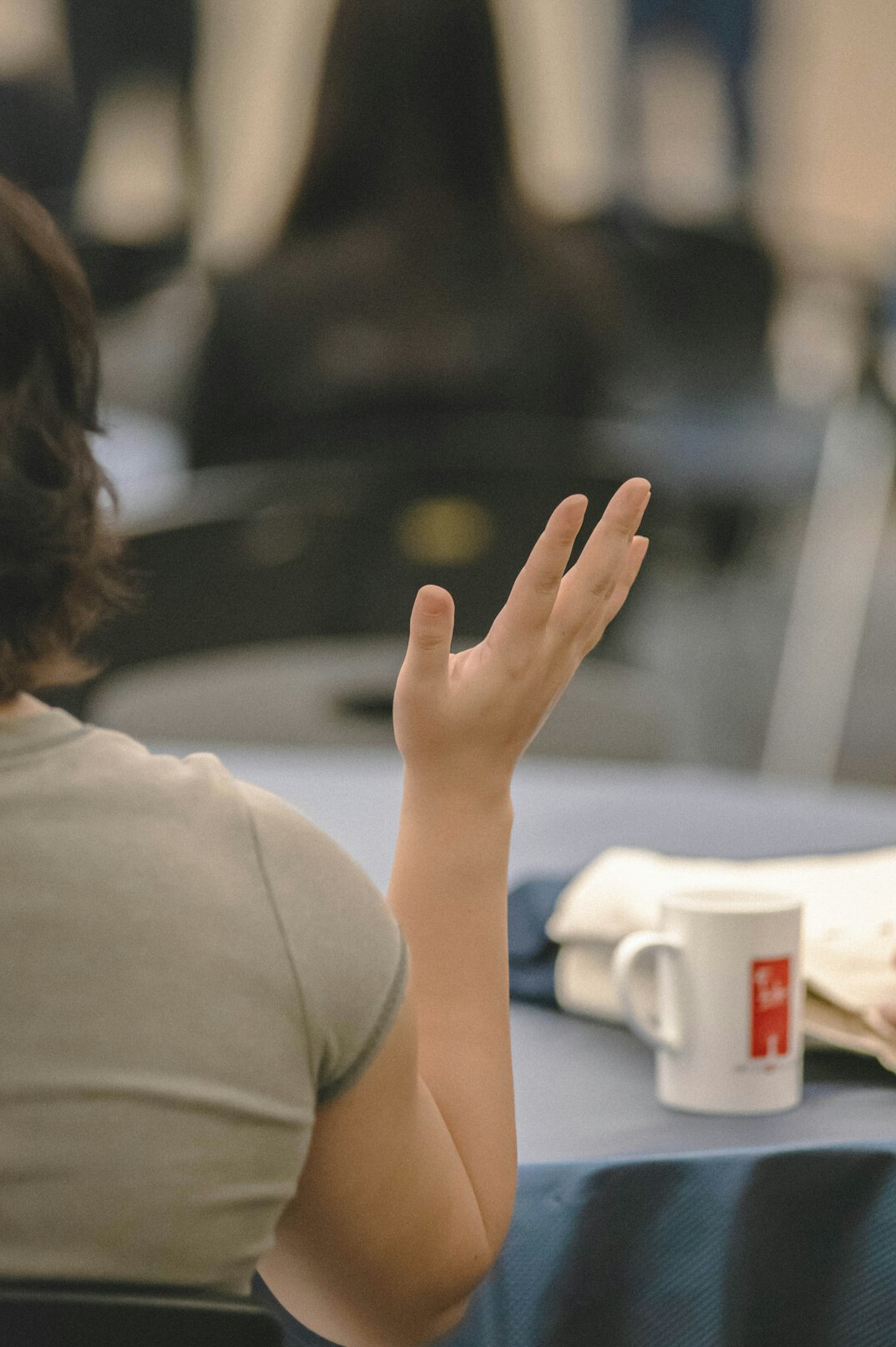 person speaking confidently in meeting