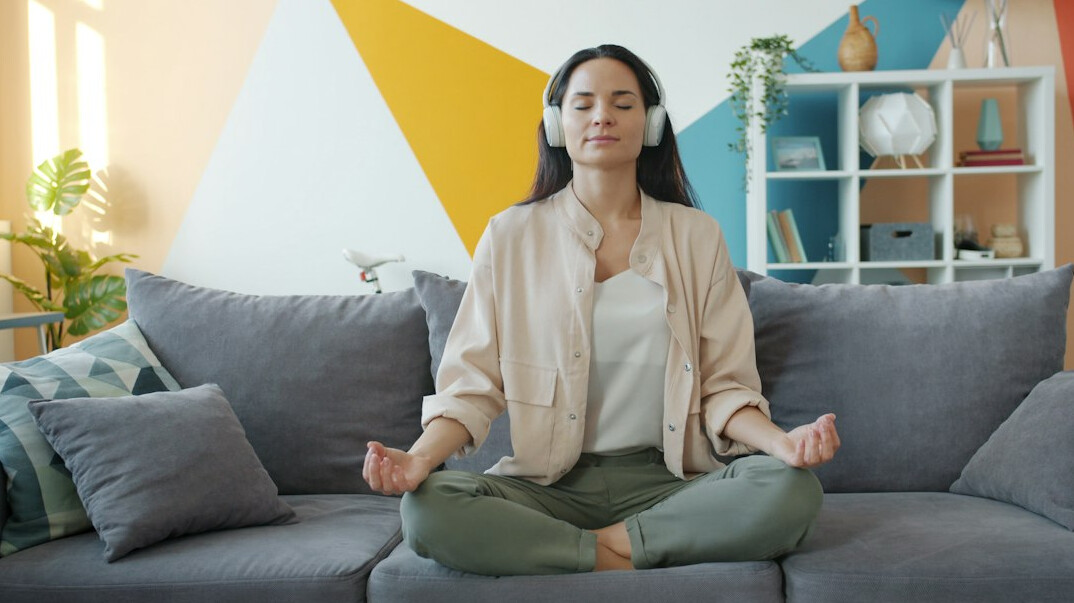 person meditating in quiet room